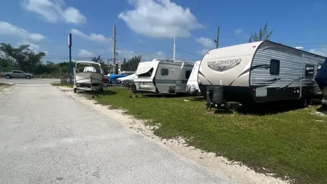 Outdoor vehicle storage with RVs and boats at Big Pine Storage.