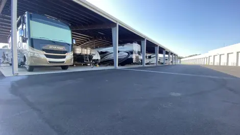 Covered RV and boat parking at Elite Motorcoach Storage.