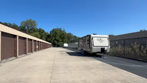 Exterior of storage units and RV parking at Lambertville Mini Storage Lewis facility.
