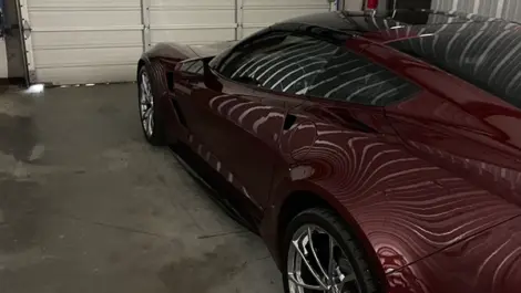 Sportscar parked in a storage unit at Volunteer Storage Lenoir City facility.