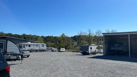 View of uncovered and covered vehicle storage at Volunteer Storage Maryville 2 facility.
