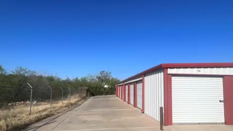 Exterior of outdoor storage at MRC Self Storage facility with paved roads.