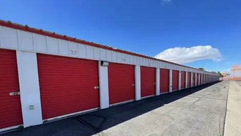 Exterior of outdoor red storage units at Mountain Vista North Mini Storage.