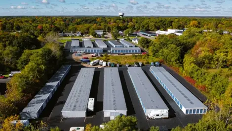 Aerial view of clean, spacious drive-up storage units with paved access at Osprey Storage Portage.