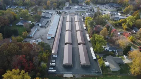 View of fenced perimeter and paved driveway at Lambertville Mini Storage Secor.