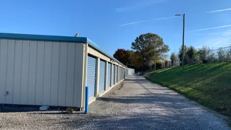 Close-up of unit doors with gravel access at Volunteer Storage Seymour.