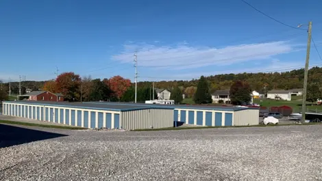 Wide-angle view of storage units and fencing at Volunteer Storage Seymour.