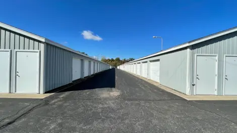 Roll-up doors on drive-up units and door units with wide paved aisle at Osprey Storage Shaver.
