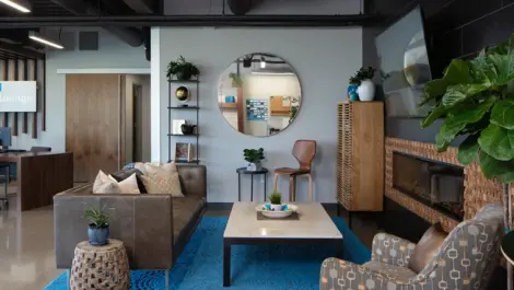 Comfortable lounge space with chairs and decor at Storage Lounge.