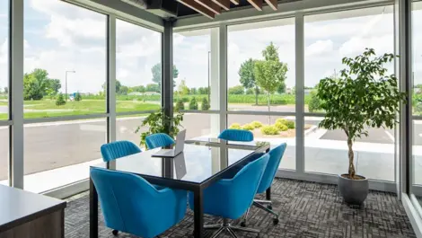 Modern lounge area with table, seating, and ambient lighting at Storage Lounge.