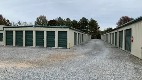 Rows of storage units at Volunteer Storage Tellico Village with gravel paths.