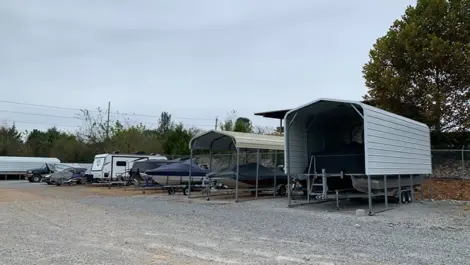 Clean gravel lanes and unit rows in front of vehicle storage at Volunteer Storage Tellico Village.
