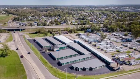 Aerial view of fenced facility with multiple unit rows at Wagner Ford Self Storage.