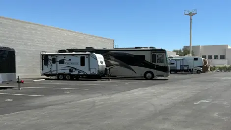 View of outdoor vehicle storage at Mountain Vista Mini Storage facility.