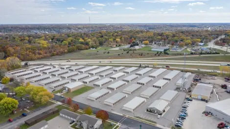 Exterior storage units with metal doors and clear access path at Osprey Storage Mankato.