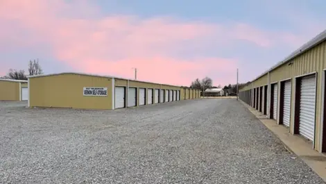 Vernon Self Storage outdoor units under pastel colored sky.