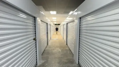 Inside hallway of Ken's Korner Mini Storage with units on each side