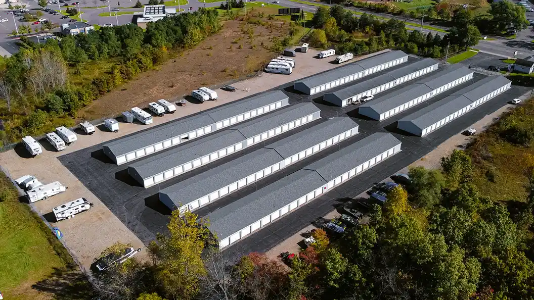 Aerial view of rows of storage units and vehicle storage at Osprey Storage Shaver.