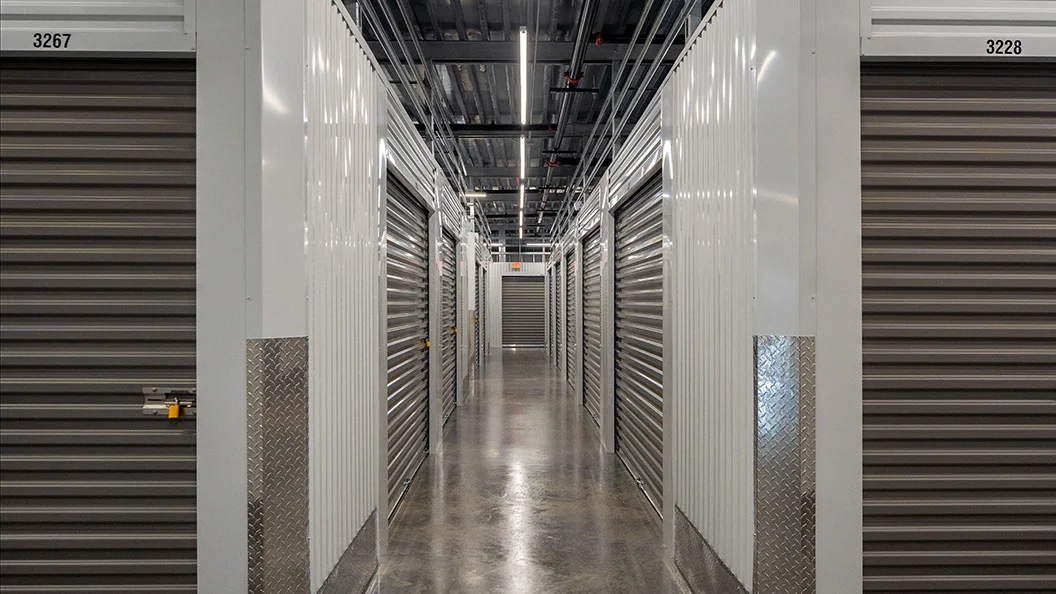 Modern interior with storage access and camera surveillance at Storage Lounge.